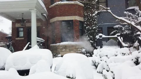 Steam from the heating system rises from the basement of the house. Stock Footage 302565758