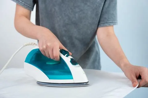 Steam Iron in Action Stock Photos