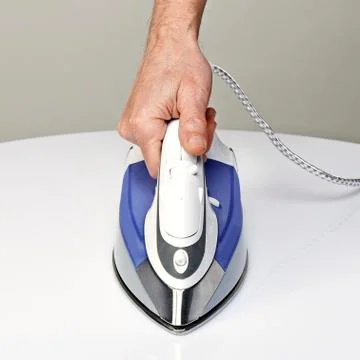 Steam iron from front Stock Photos