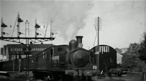 Steam locomotive leaving a station on the Isle of Wight old B&W film Stock Footage