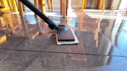 A steam mop is used from a side angle Stock Footage 328873607