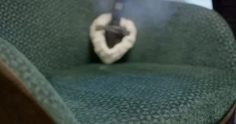 Steam Nozzle Pressing Deep Into Green Upholstery Fabric Vídeo Stock 340280312