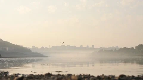 Steam Over The Current Belaya River in Ufa. A Flying Bird. The Bridge and the Ci Stock Footage 197334958