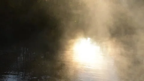 Steam over the river against the background of the rising sun Stock Footage 142740326