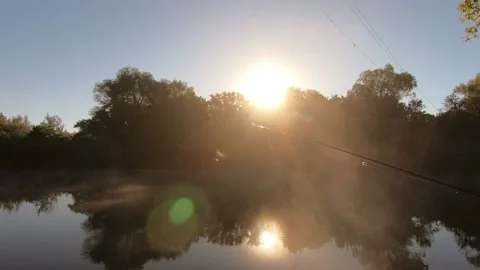 Steam over water in the rays of the rising sun. Stock Footage 140095103