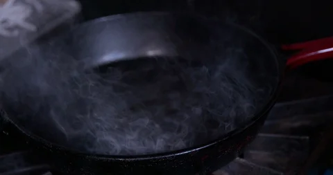 Steam in a pan in slow motion Stock Footage 87846420