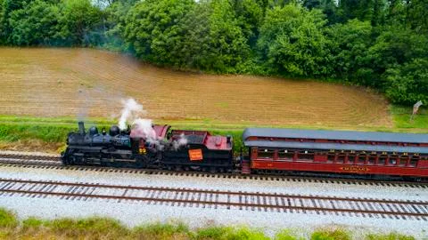 Steam Passenger Train Pulling into Picnic Area by Drone Stock Photos