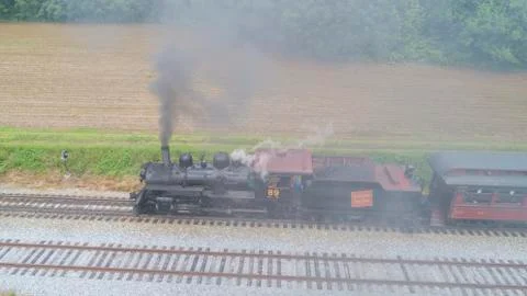 Steam Passenger Train Pulling into Picnic Area by Drone Stock Photos