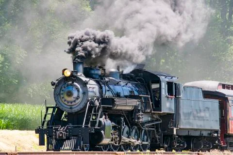 Steam Passenger Train Pulling into Picnic Area Stock Photos