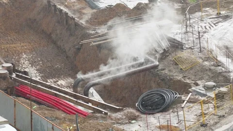 Steam from Pipes at a Construction Site Stock Footage 315051541