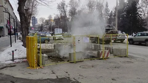 Steam rises above the ground after a heating main burst. Stock Footage 303078784