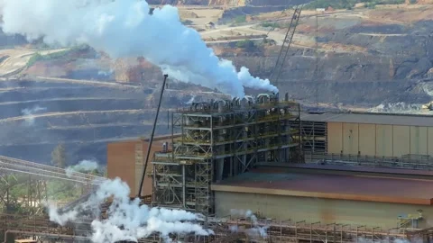 Steam rises from Barrick Gold mining facility Stock Footage 310605184
