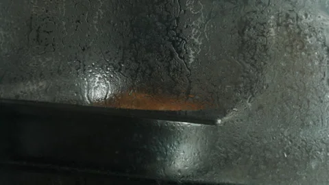 Steam rises from a cooking oven in a kitchen during meal preparation Видео 345030739