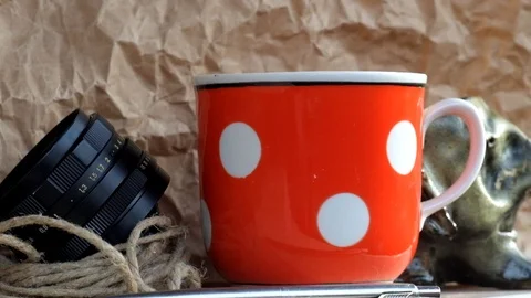 Steam rises over a cup of hot tea Stock Footage 89136839