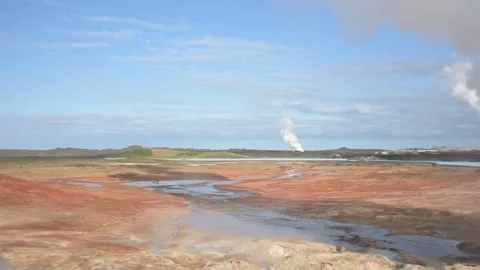 Steam Rises Over Sulfur Pools and Stream at Gunnuhver, Iceland Stock Footage 345179804