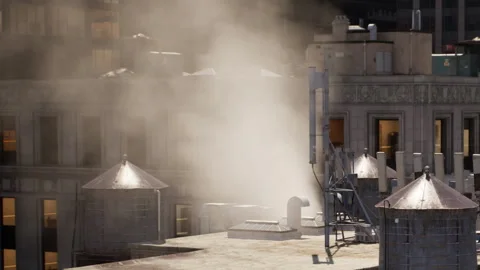 Steam rises from rooftop structures in a city setting during daytime Stock Footage 344098482