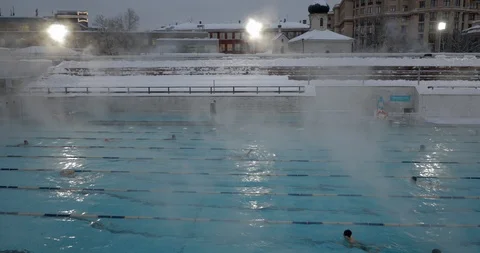 Steam Rises Slowly Over An Open Swimming Pool in winter Video stock 85591770