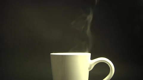 Steam Rises From the white Cup. White smoke on black background. Stock Footage 50895434