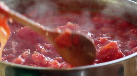 Steam rising of a large batch of tomatoes prepared for canning Stock Footage 41472567