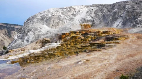 Steam Rising from Mammoth Hot Springs in Yellowstone National Park Stock Footage 128036053
