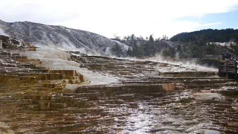 Steam rising over the travertine formation from Mammoth Hot Springs Stock Footage 128034384