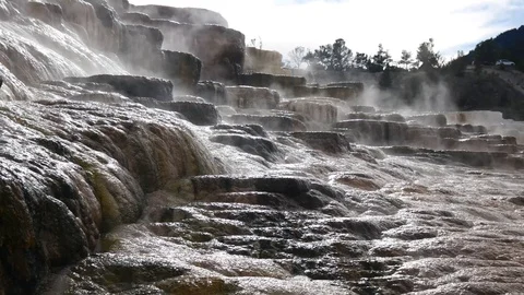 Steam rising over the travertine formation from Mammoth Hot Springs Stock Footage 128035570