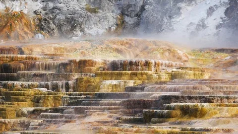 Steam rising over the travertine formation from Mammoth Hot Springs Stock Footage 128035644