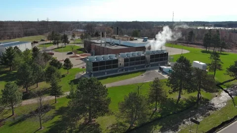 Steam rising from power distribution facility Stock Footage 307600547