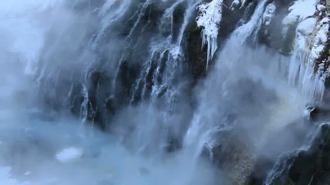 Steam Rising from the White Beard Falls and Ice Waterfall Stock Footage 324970120
