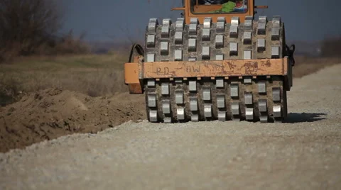 Steam roller road machine working on gravel road Stock Footage 57964671