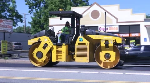 Steam Roller smooth out new asphalt street Video stock 66517132