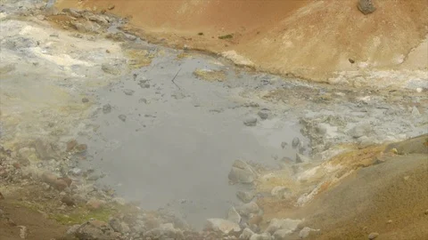 Steam Rolling Over Rock-Filled Pool Stock Footage 86754557