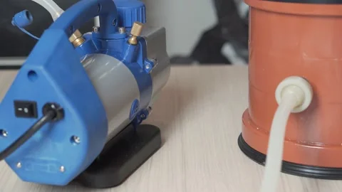 Steam from a running vacuum pump. Stock Footage 153548299