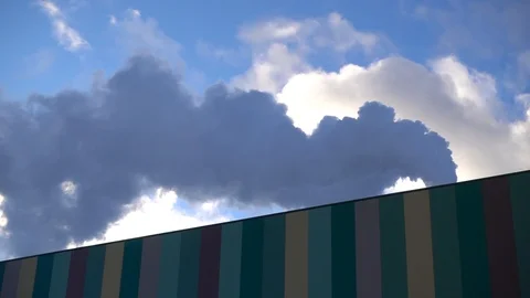 Steam from smoke stack across sky. Slow motion Stock Footage 85594120
