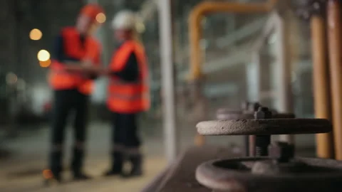 Steam taps, blurry background. Two workers industrial plant, working together 스톡 동영상 145994850