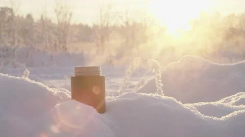 Steam from thermos in the snowy landscape Stock Footage 231775813