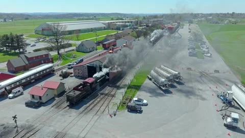 Steam Train Activity at the Old Railway Station in the Morning Sun in a Rur.. Stock Footage 341436234