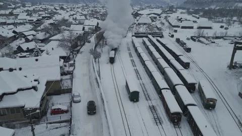 Steam Train Approaching Through Snowy Rail Yard Stock Footage 341766986
