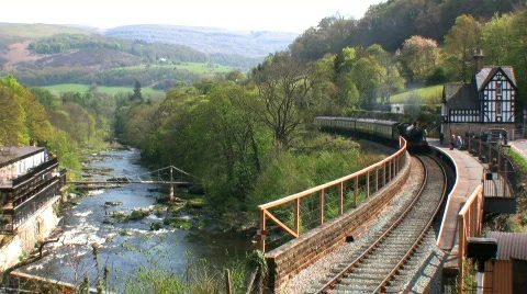 Steam train arriving at the station Stock Footage 710784