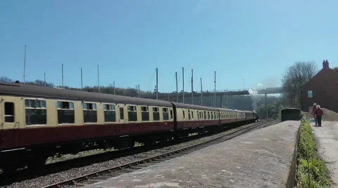 Steam train backs up tracks into Whitby station Stock Footage 2923319