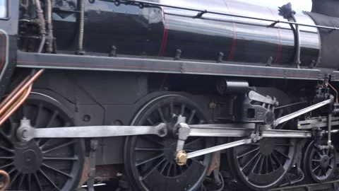 Steam Train close up old style image wheels turning close up UK England 4K Stock Footage 316989231