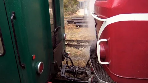 Steam train at coupling device and railway track Stock Footage 101175840