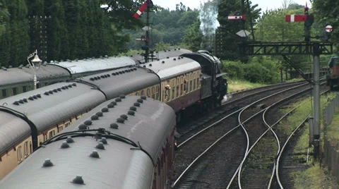 Steam train departs pulling carriages Video stock 39890843