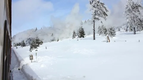 Steam train drives through winter landscape Stock Footage 70961787