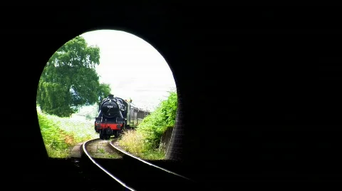 Steam train entering tunnel, JVC GY-HM100E Stock Footage