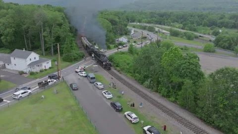 Steam Train known as Big Boy Travels Through a Small Town With People Watch.. Stock Footage 340340253