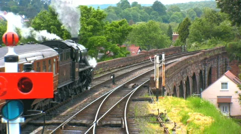 Steam train leaving station Stock Footage 139773