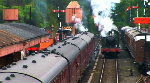Steam train leaving the station Stock Footage 268775