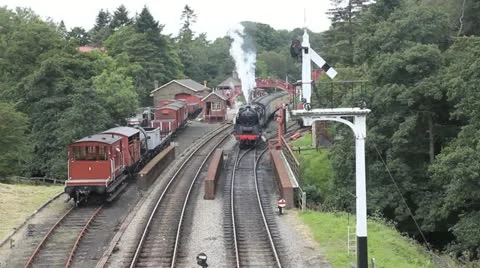 Steam train leaving station Stock-Footage 12050245
