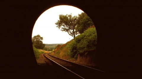 Steam train leaving tunnel Stock Footage 479237